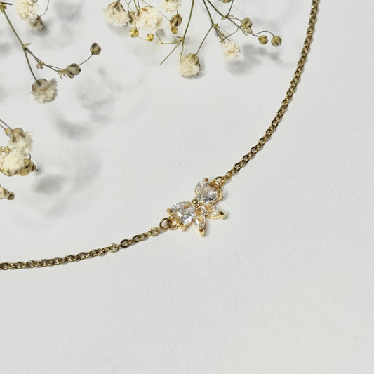 Bracelet en acier inoxydable doré connecteur noeud en oxyde de zirconium blanc