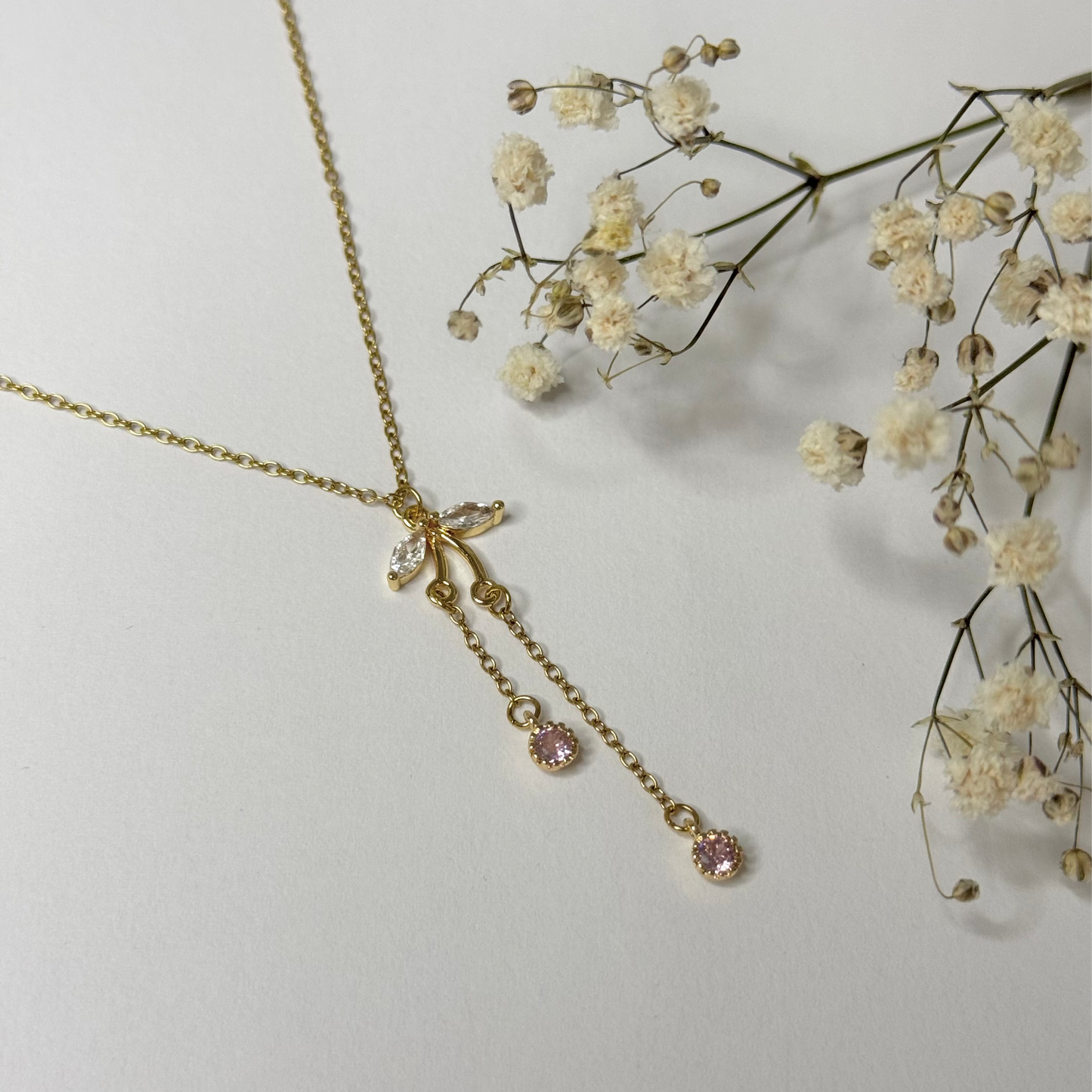 Collier doré en acier inoxydable et pendentif en oxyde de zirconium rose