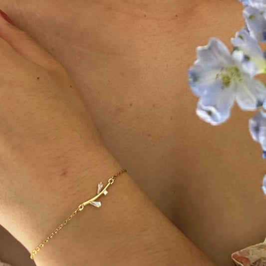 bracelet petit poignet réglable dore acier inoxydable branche oxyde de zirconium blanc