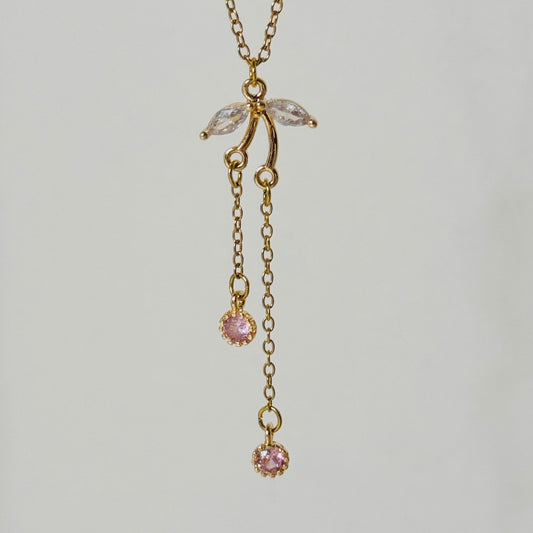 collier dore acier inoxydable pendentif asymetrique rond rose pale oxyde de zirconium