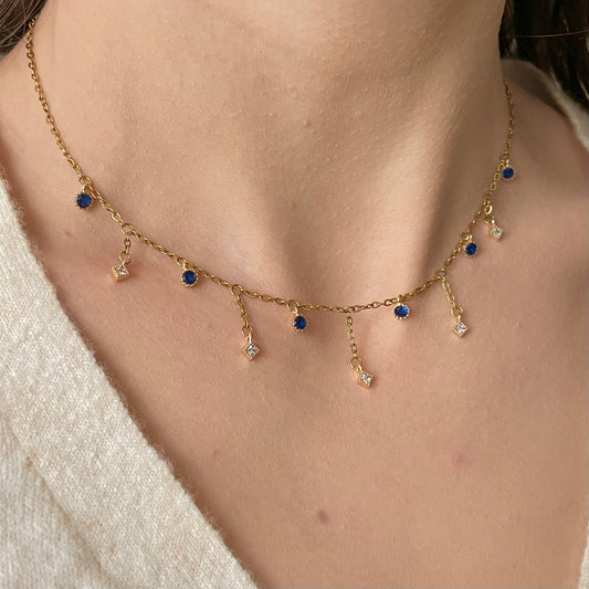 Collier acier inoxydable doré pendentifs zircon bleu foncé et losanges
