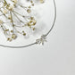 Collier argenté acier inoxydable pendentif noeud minimaliste élégant romantique.